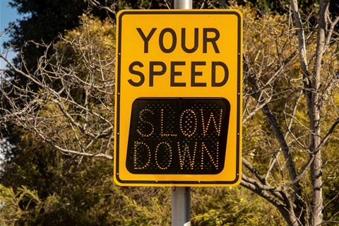 slow down road sign.jpg