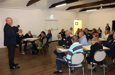 a group of people sitting in a hall