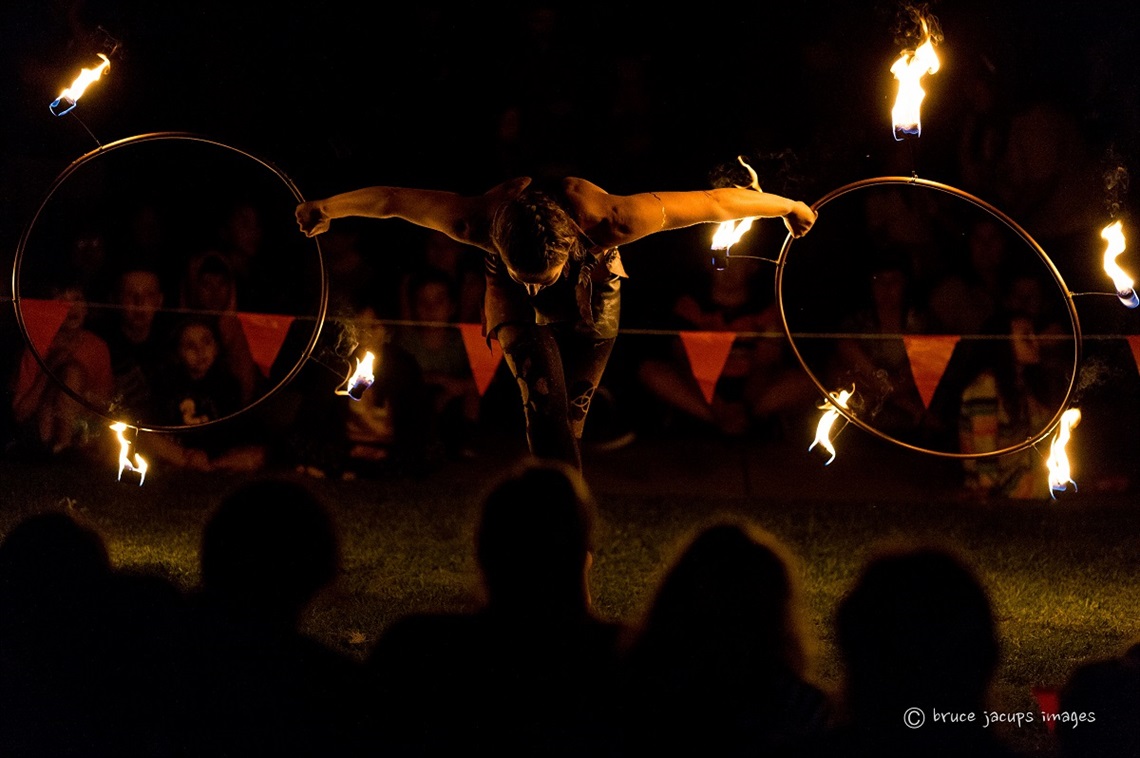 a performer twirling fire