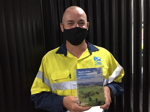 Council Weeds Officer Jack Hiscock with the Weeds of the North Coast of NSW Book