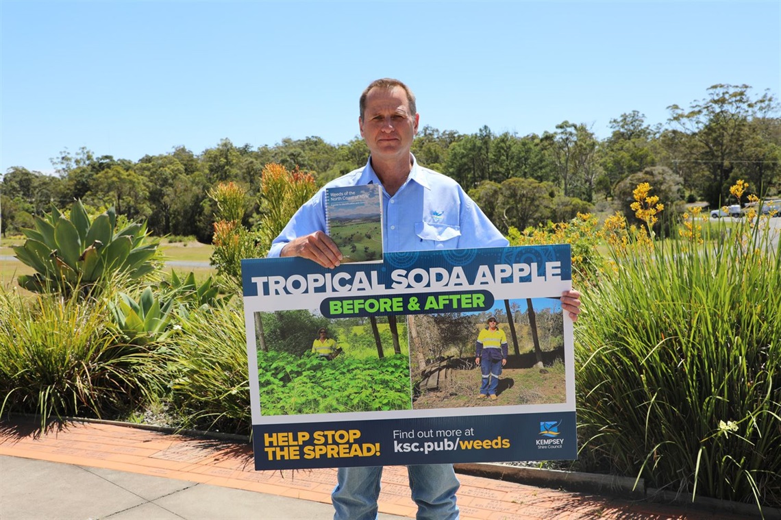 a man holding a sign