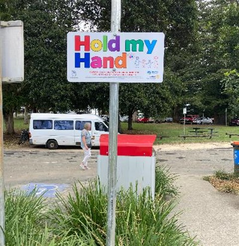 sign that says Hold my Hand