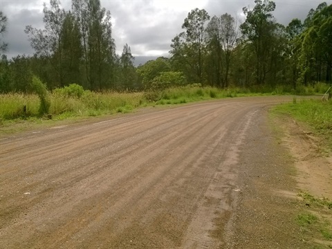 an unsealed section of road on spooners avenue