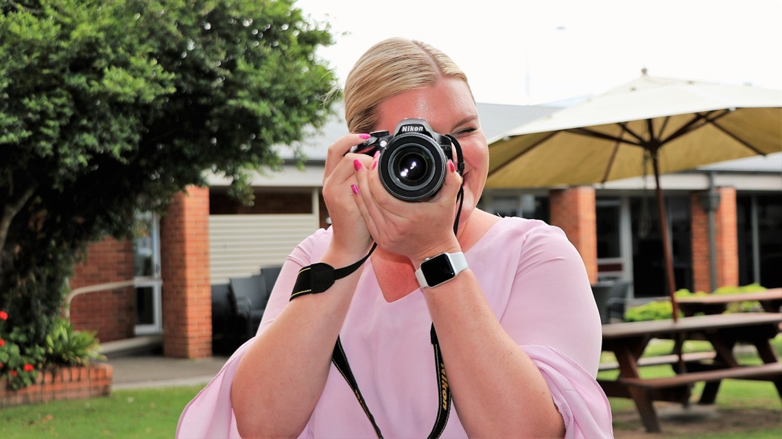 a person holding a camera