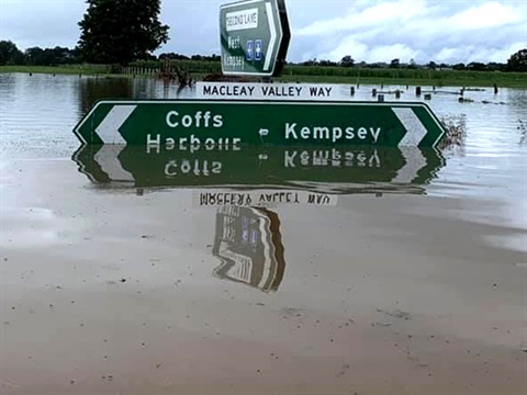 Submerged road sign in flood