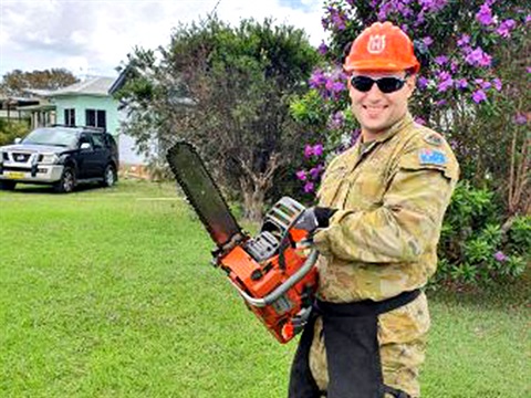 ADF with chainsaw to help flood clean-up