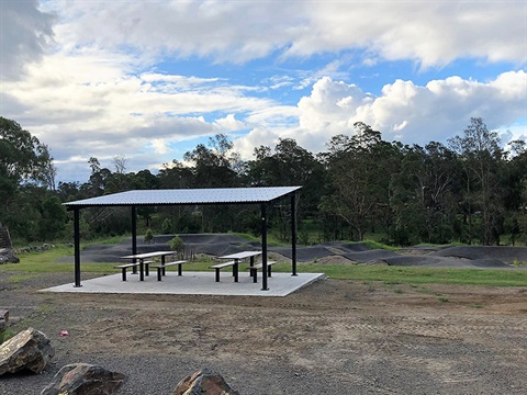 shade and seating at the pump track